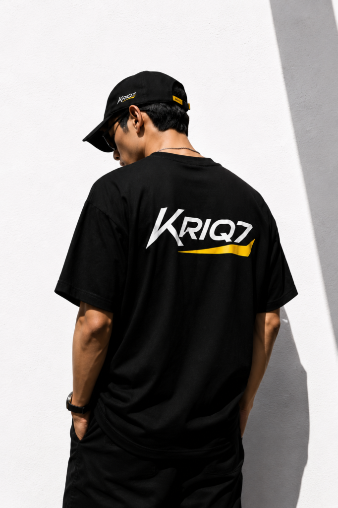Male model wearing KRIQ7 black oversized unisex t-shirt